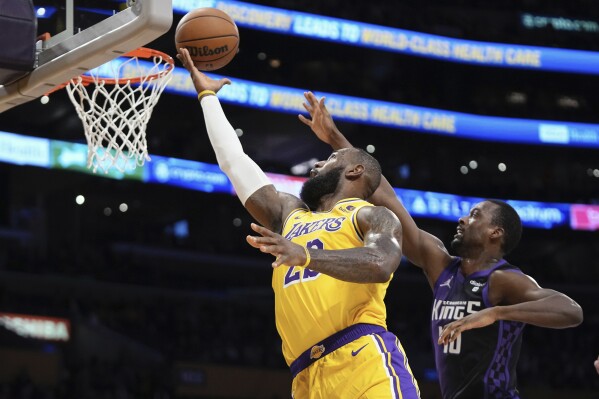 Kings overcome LeBron s triple double hold on in 4th quarter for